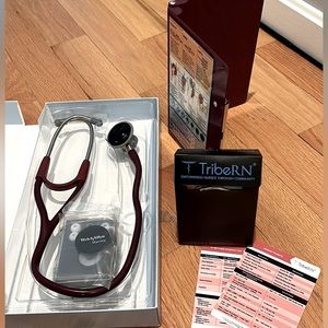 Stethoscope, medical reference cards and foldable clipboard